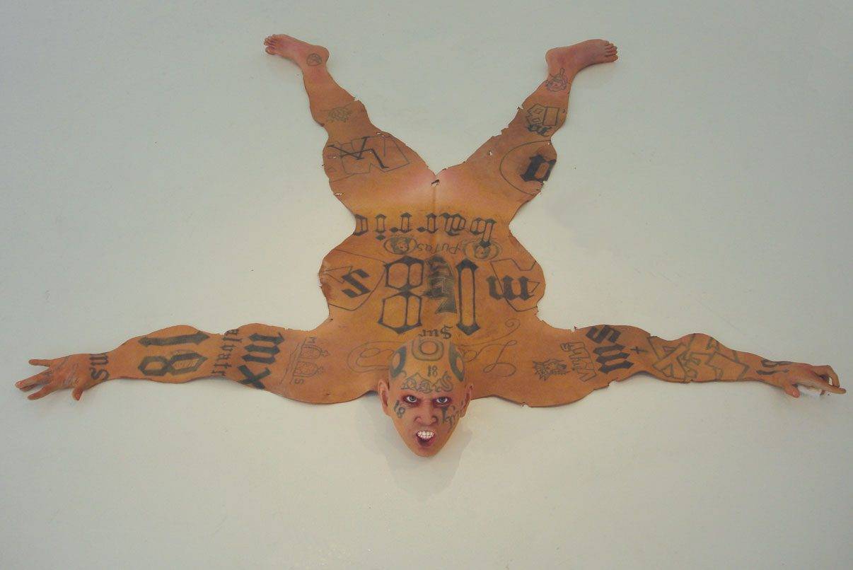 Tattooes on gangbanger skin