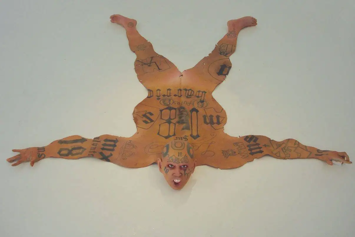 Tattooes on gangbanger skin