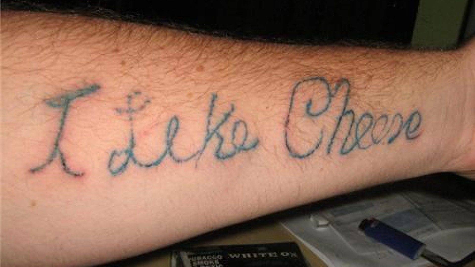 self tattoo of I Life Cheese on Arm