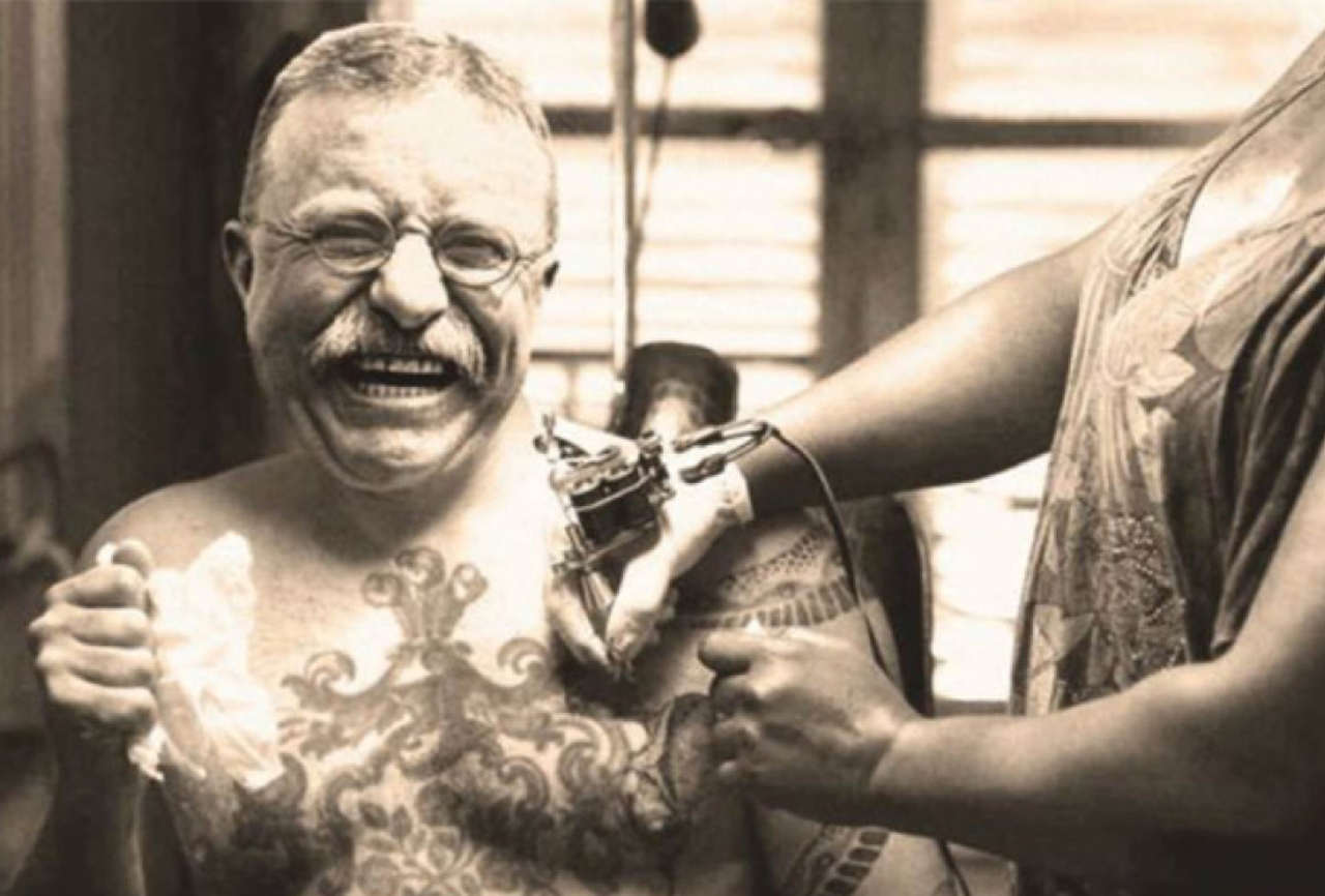 Man getting tattoo on chest from professional tattoo artist.