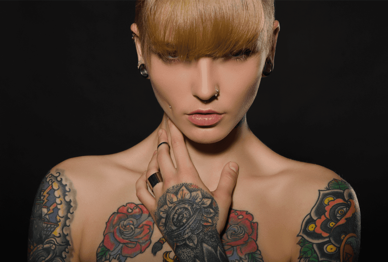 A tattooed girl with piercing